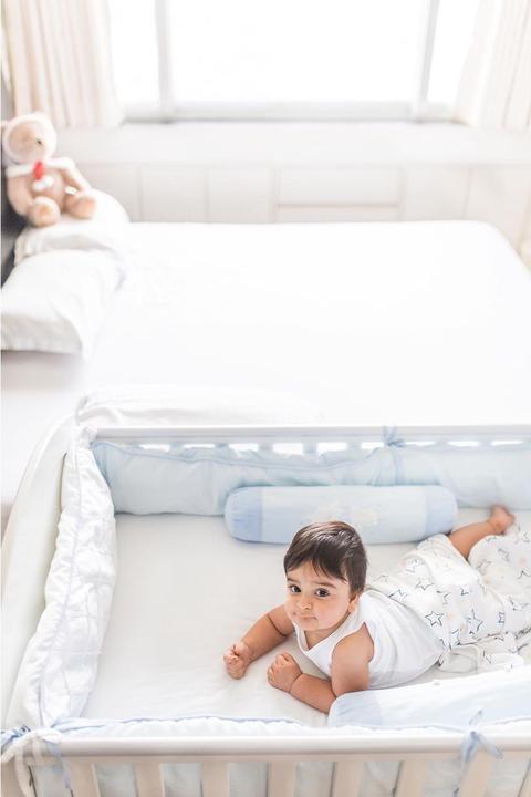 baby in white bed